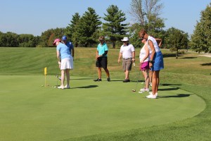 people golfing